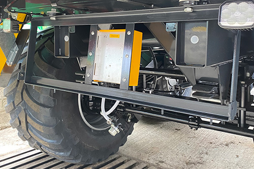Dflow pump module on underslung tank mounting bracket on a forage wagon