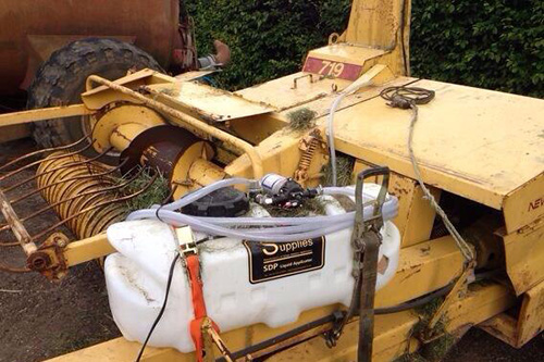 DIY basic slage applicator on a trailed forage harvester